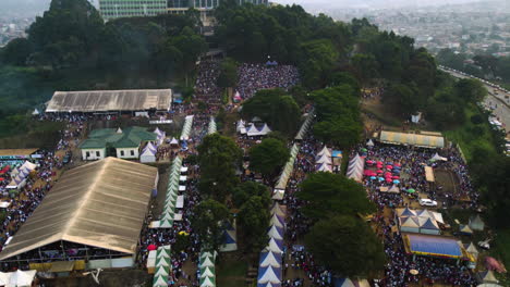 Drone-tilting-backwards-over-people-at-the-Yafe-Yaounde-Festival-in-sunny-Cameroon