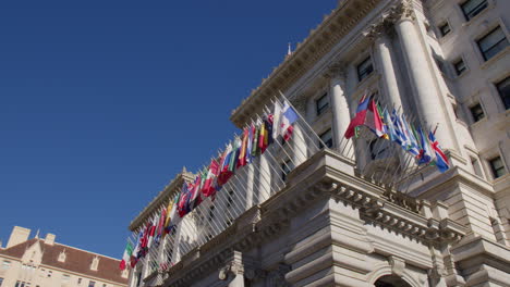 The-Fairmont-Hotel-Adorned-with-International-Flags-in-San-Francisco,-California---Low-Angle-Shot