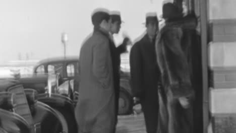 Men-in-Elegant-Suits-and-Hats-Walk-Into-a-Building-in-New-York-1930s