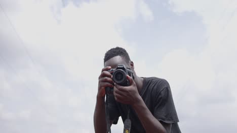 African-American-Photographer-Taking-Photos-Of-Police-Brutality-With-DSLR-Camera