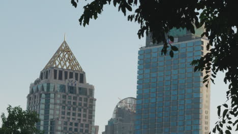 Tall-glass-building-in-residential-developed-area-in-Bangkok-Thailand