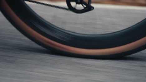 Close-up-video-about-a-rolling-wheel-on-a-road-bike