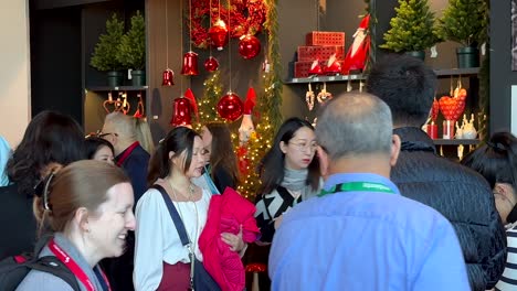 Asian-woman-and-man-at-Christmas-trade-fair-in-Frankfurt