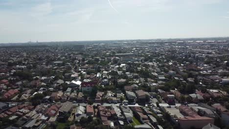 Incredible-aerial-shot-of-a-town-or-village-with-its-houses-and-huts-among-the-trees-and-nature