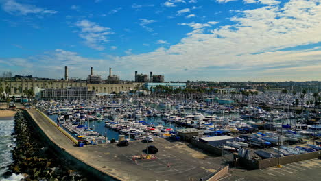 Docks-of-King-Harbor-Yacht-club-with-moored-vessels,-aerial-view