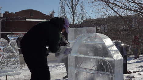 Ice-sculptor-crafting-ice-sculptures-in-slow-motion-detail