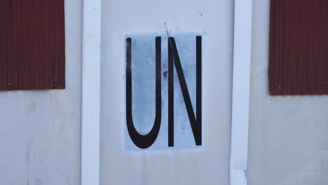 Close-up-of-United-Nations-sprayed-on-the-side-of-a-shipping-container-in-the-capital-city-of-East-Timor,-Southeast-Asia