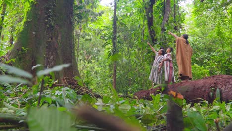 Indigenous-people-exploring-lush-green-rainforest-in-Pucallpa,-Peru,-during-daylight,-surrounded-by-rich-vegetation