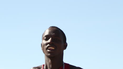 Young-Man-Jumping-Up-and-Down-During-Ceremonial-Event-In-Masai-Mara,-Kenya