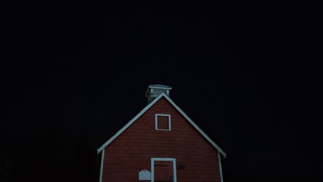 Charming-little,-red,-historical-one-room-school-in-the-snow-at-night