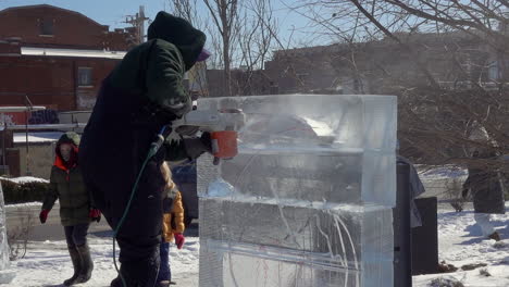 Ice-sculptor-crafting-ice-sculptures-in-slow-motion-detail