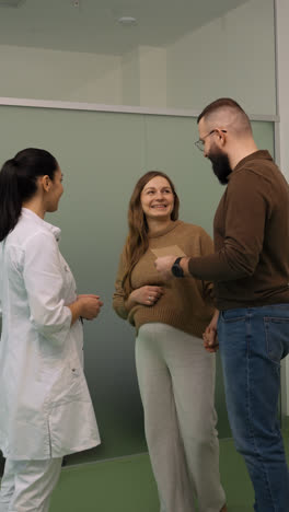 Happy-couple-at-doctor's-office