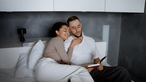 Sweet-couple-kissing-on-bed