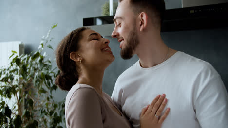 Happy-couple-kissing-at-home