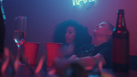 Two-girls-sitting-at-the-party