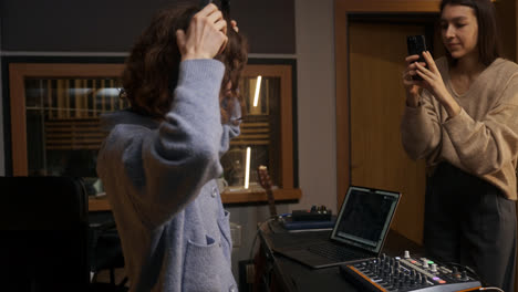 Woman-recording-with-smartphone