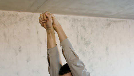 Man-stretching-indoors