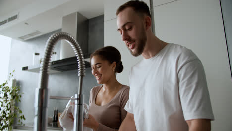 Lovely-couple-talking-and-kissing-at-home