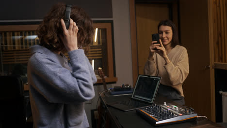 Woman-recording-with-smartphone