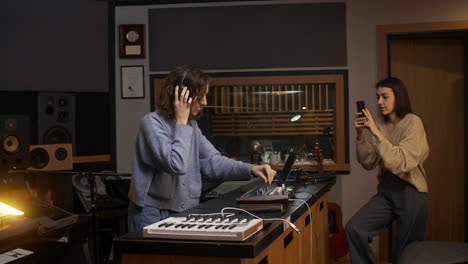 Woman-recording-with-smartphone