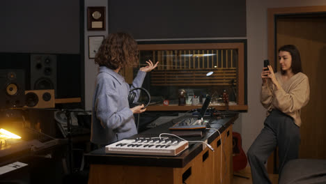 Woman-recording-with-smartphone