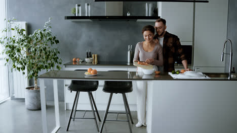 Couple-kissing-in-the-kitchen