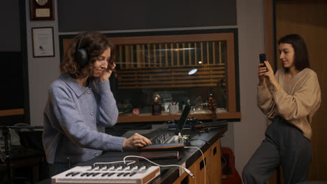 Woman-recording-with-smartphone