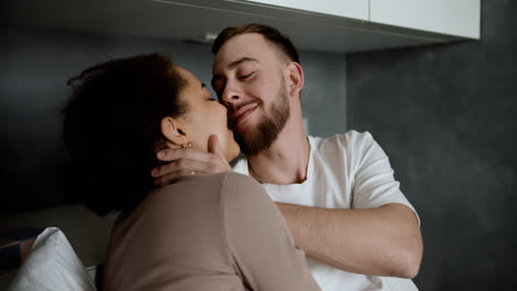 Sweet-couple-kissing-on-bed