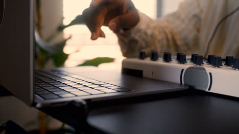 Person-with-headphones-playing-music