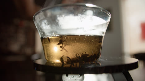 Man-pouring-hot-water-in-teacup