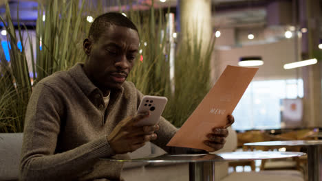 Man-sitting-at-the-restaurant