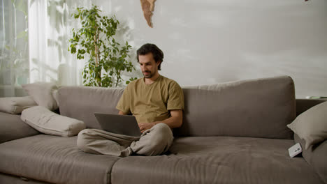 Man-working-with-laptop-at-home