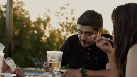 Man-having-lunch-with-family