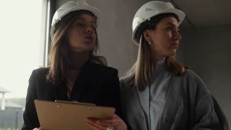 Women-with-hardhats-in-a-empty-house