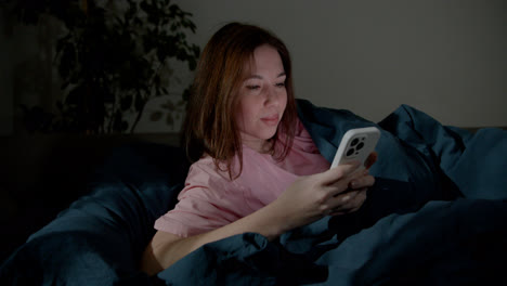 Woman-using-smartphone-at-night