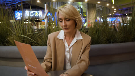 Woman-sitting-at-the-restaurant