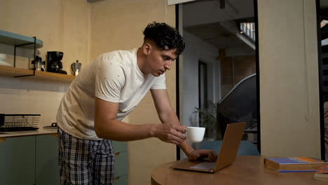 Latin-guy-drinking-coffee-at-home