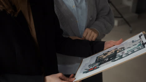 Woman-holding-clipboard-indoors