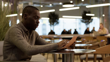 Man-sitting-at-the-restaurant