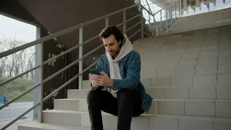 Man-sitting-on-the-stairs