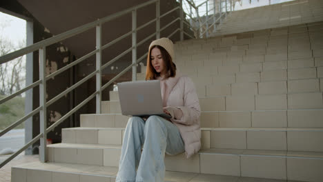 Woman-sitting-on-the-stairs