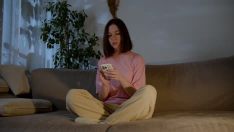 Woman-using-smartphone-at-home