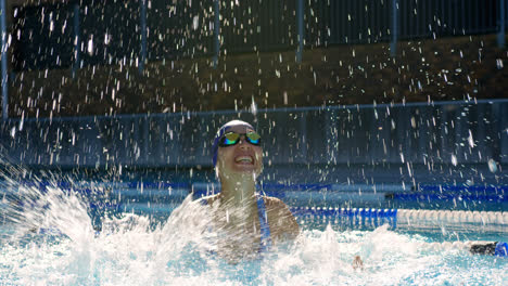 Excited-female-swimmer-cheering-in-swimming-pool-4k