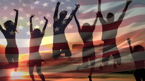 Friends-jumping-in-the-beach-at-sunset-and-the-American-flag-on-fourth-of-july