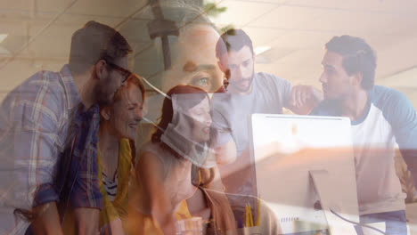 Woman-in-face-mask-against-office-colleagues-using-computer