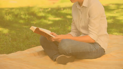 Zap-text-on-speech-bubble-against-woman-reading-a-book