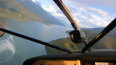 Aircraft-flying-over-the-river-and-landscape-4k