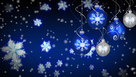 Animation-of-christmas-blue-and-silver-baubles-and-decorations-hanging-with-snow-falling