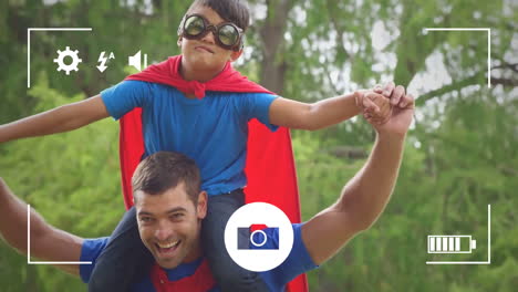 Taking-photos-of-father-and-son-in-garden-on-a-digital-camera