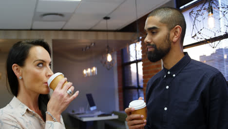 Executives-interacting-with-each-other-while-having-coffee-4k